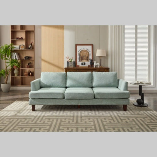 Light green 3-seater fabric sofa with USB ports in a cozy living room