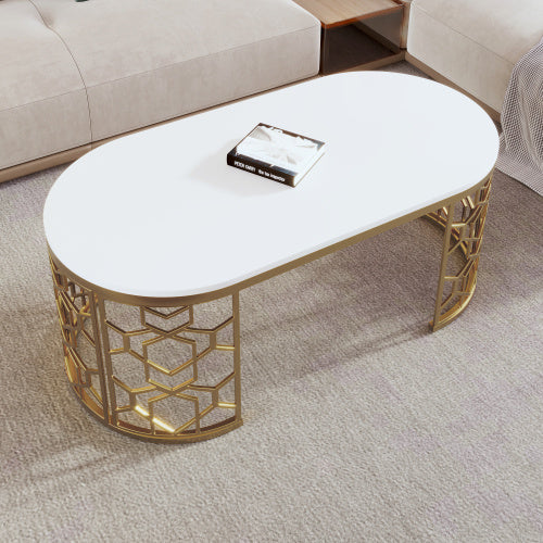 Elegant modern oval coffee table with gold stainless steel cut-out pattern frame and white MDF top.