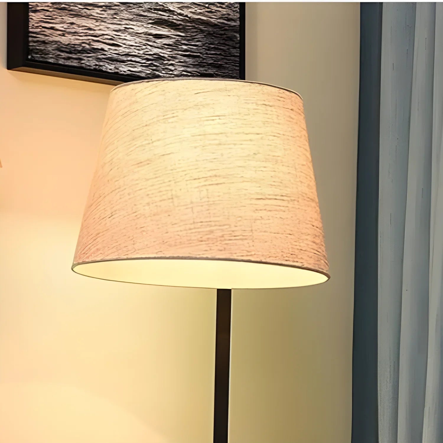 Beige fabric lampshade illuminated from within