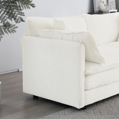 White chenille loveseat sofa with cushions on a wooden floor