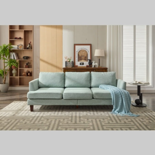 Light green 3-seater fabric sofa with USB ports in a cozy living room