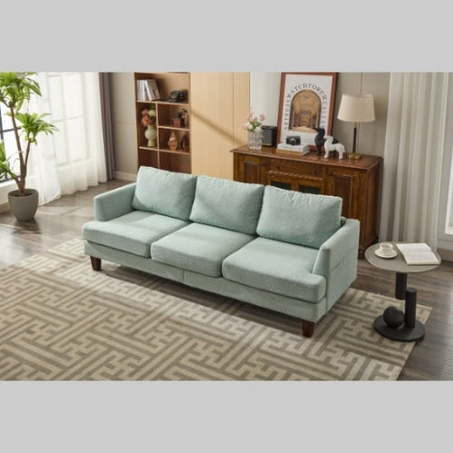 Light green 3-seater fabric sofa with USB ports in a cozy living room