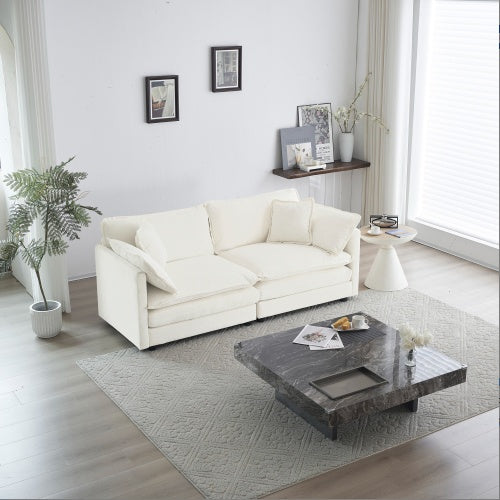 White chenille loveseat sofa with cushions on a wooden floor